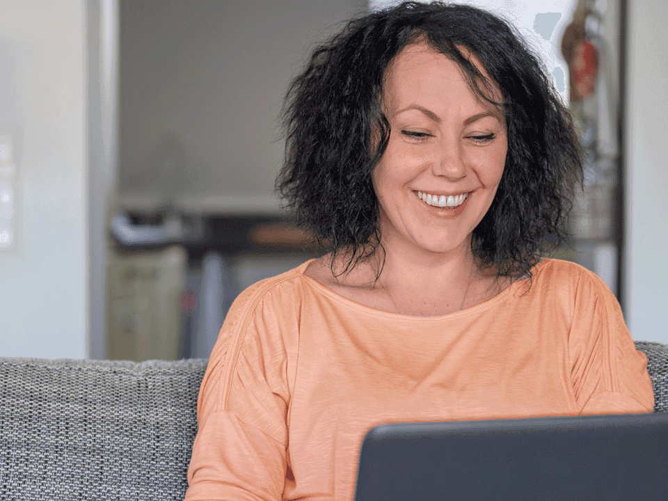 An employee at a laptop.