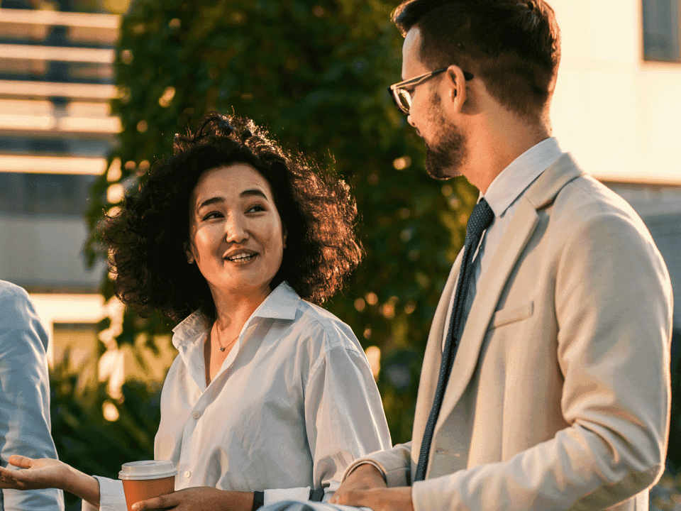 Colleagues walk and talk.